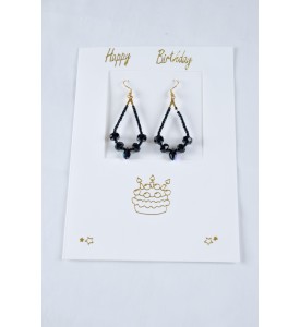 Adzo Jewellery card with black Swarovski crystal drop earrings on gold plated finish